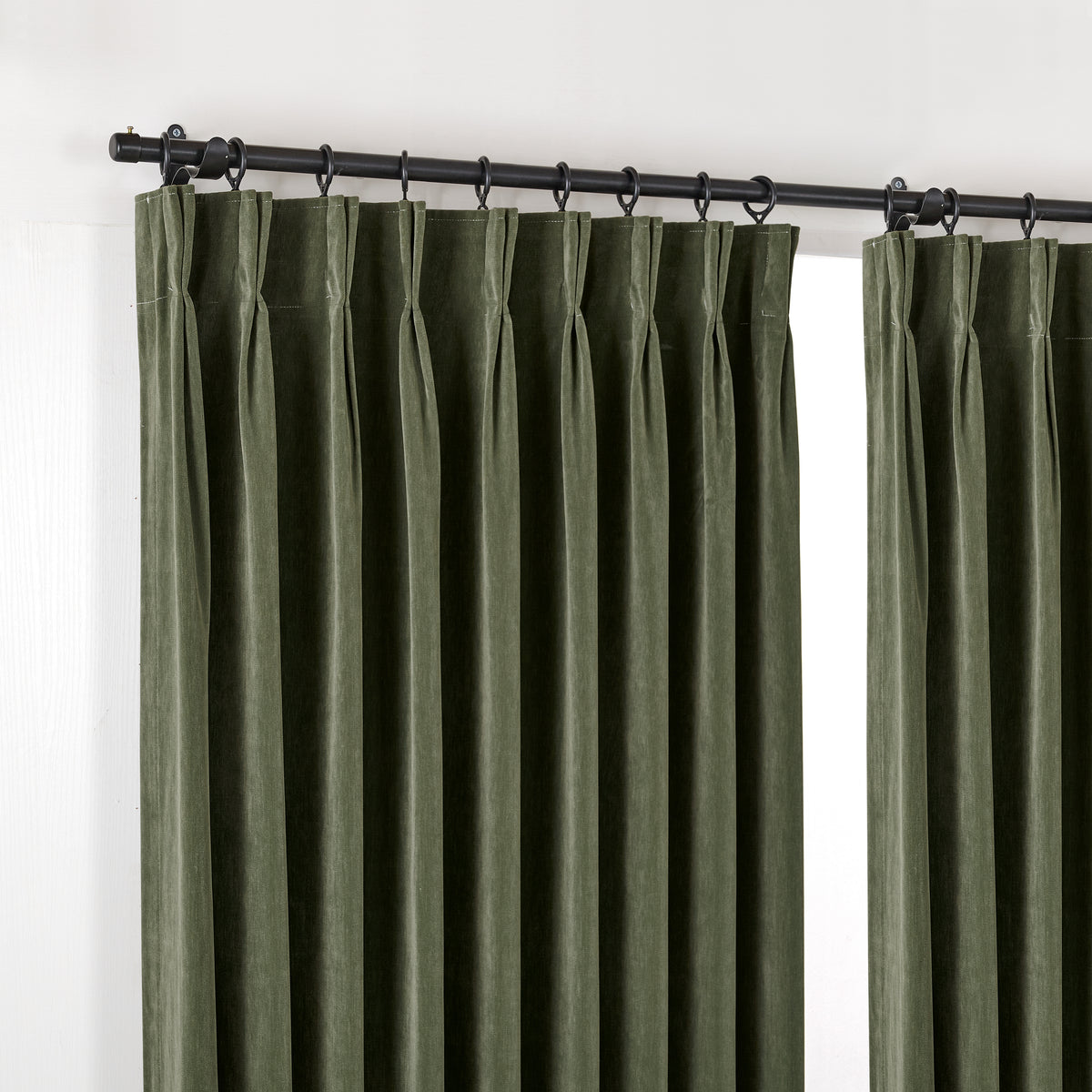 Sebastian Double-Faced Velvet Blackout Curtains in Forest, hanging at the window
