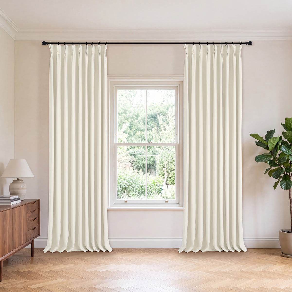 Genevieve Cloud-Soft Chenille Blackout Curtains in Ivory, hanging in a room