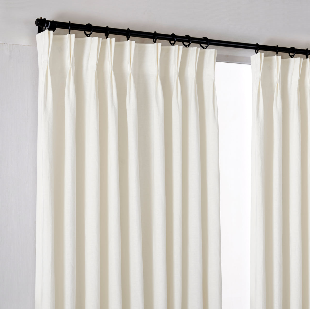 Ainsley Pure Linen Curtains in Ivory, hanging at the window