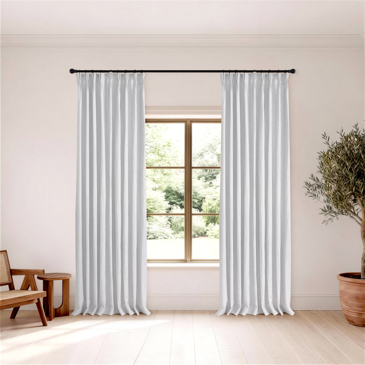 Rafe Slubbed Pure Linen Curtains in Powder Blue, hanging in a room