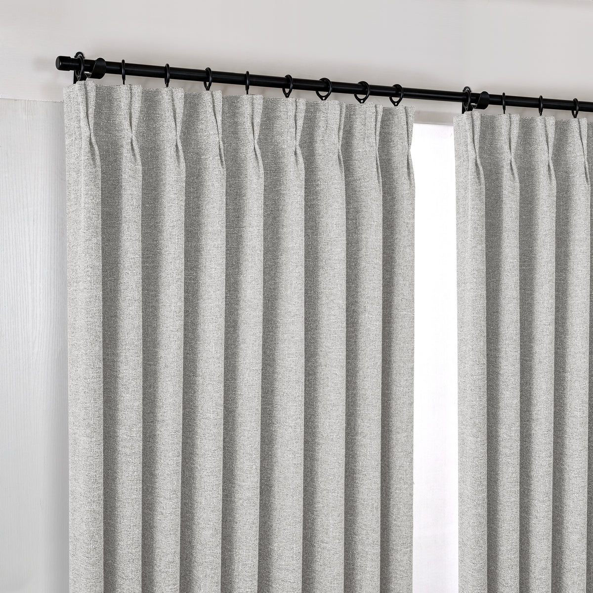 Tamsin Melange Weave Blackout Curtains in Oat, hanging at the window