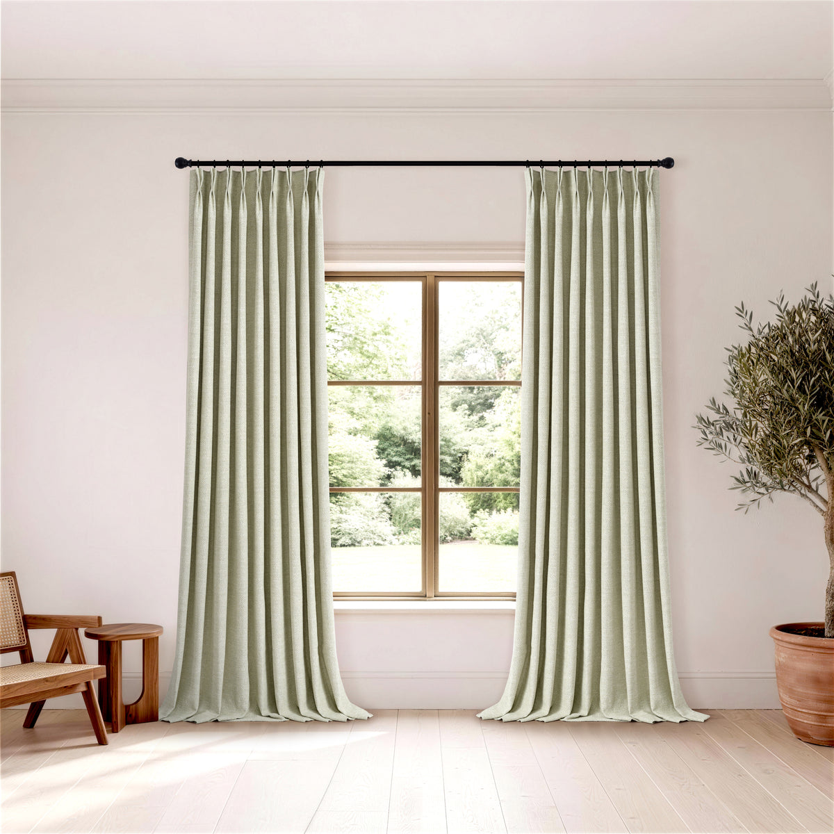 Pembroke Herringbone Weave Curtains in Pale Olive, hanging in a room