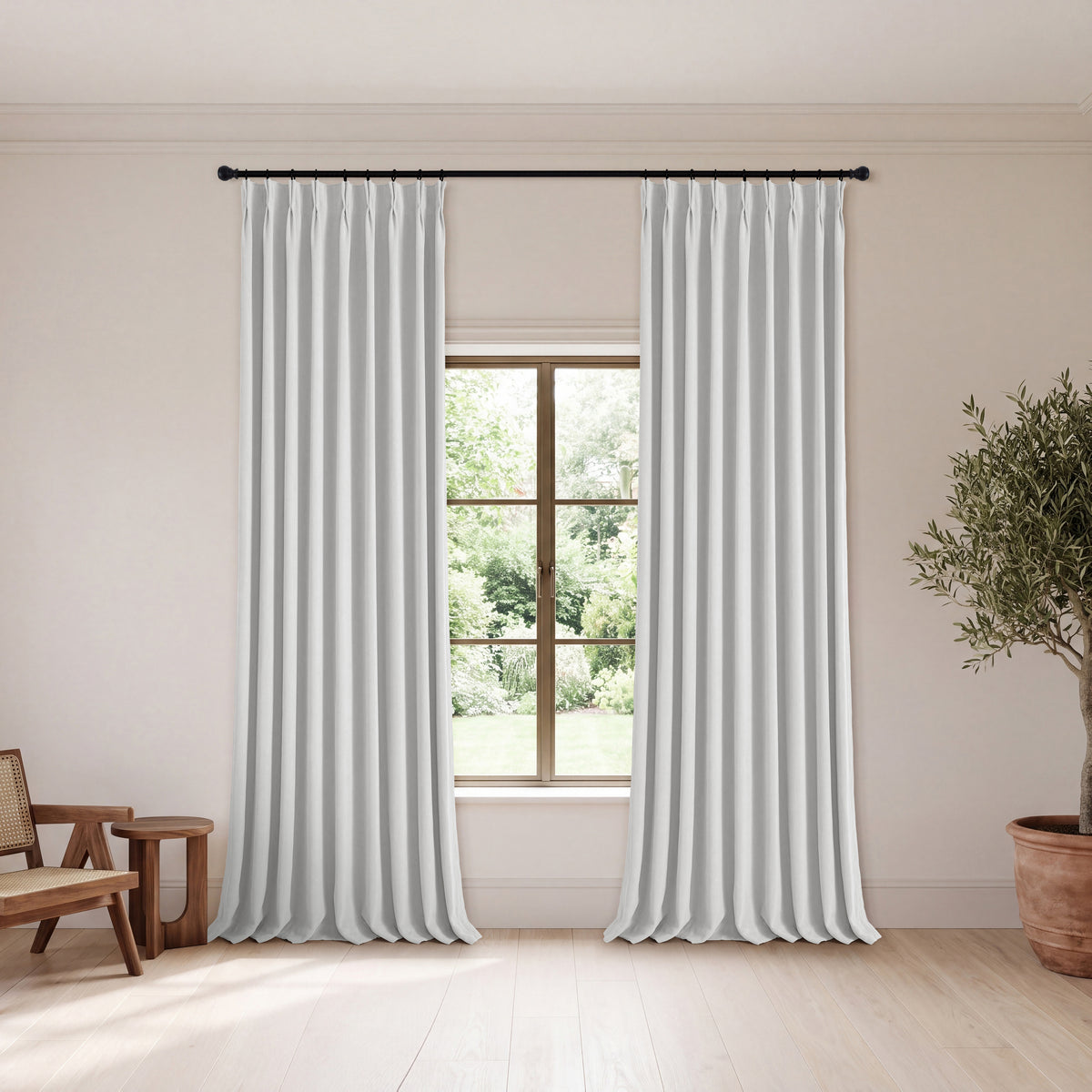 Genevieve Cloud-Soft Chenille Blackout Curtains in Chalk, hanging in a room