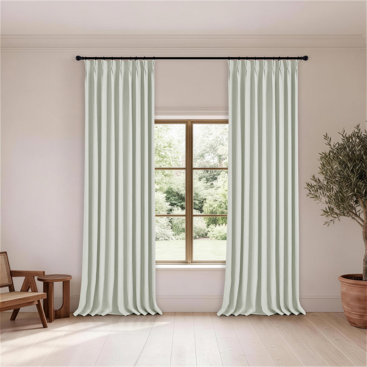 Ingram Brushed Weave Blackout Curtains in Mint, hanging in a room