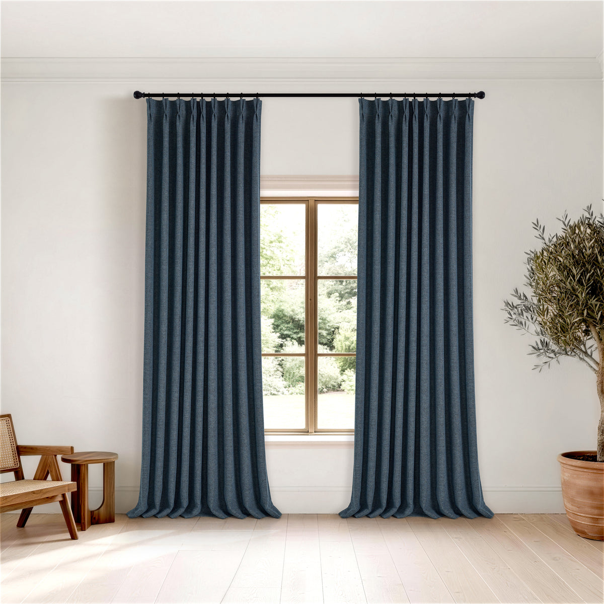 Kendall Basketweave Blackout Curtains in Navy, hanging in a room