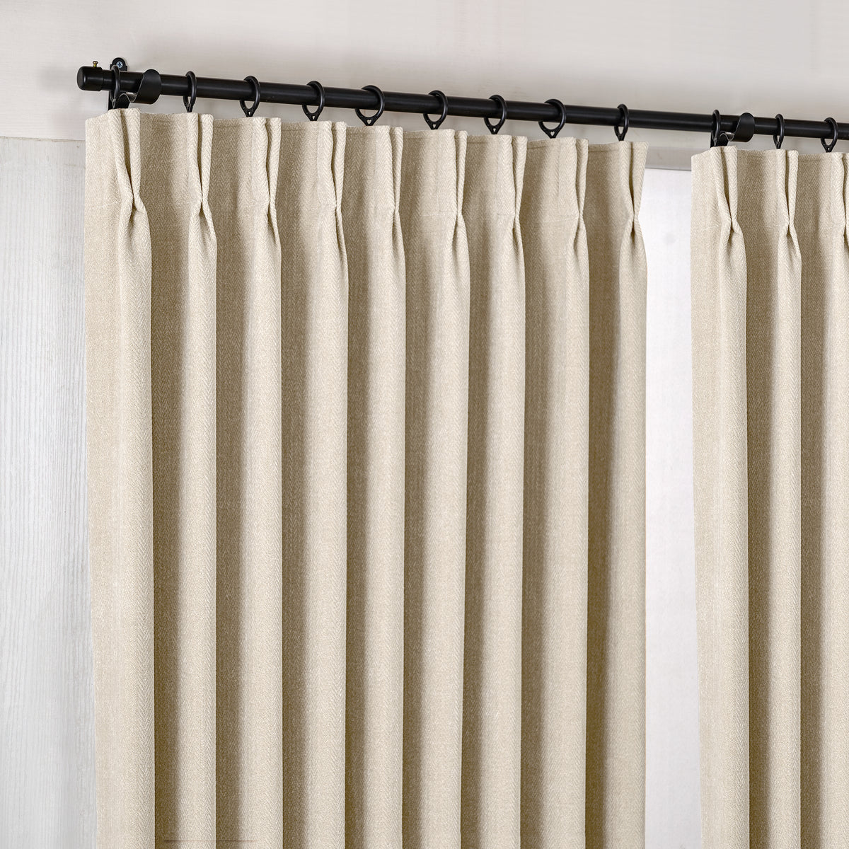 Hadleigh Herringbone Blackout Curtains in Oat, hanging at the window