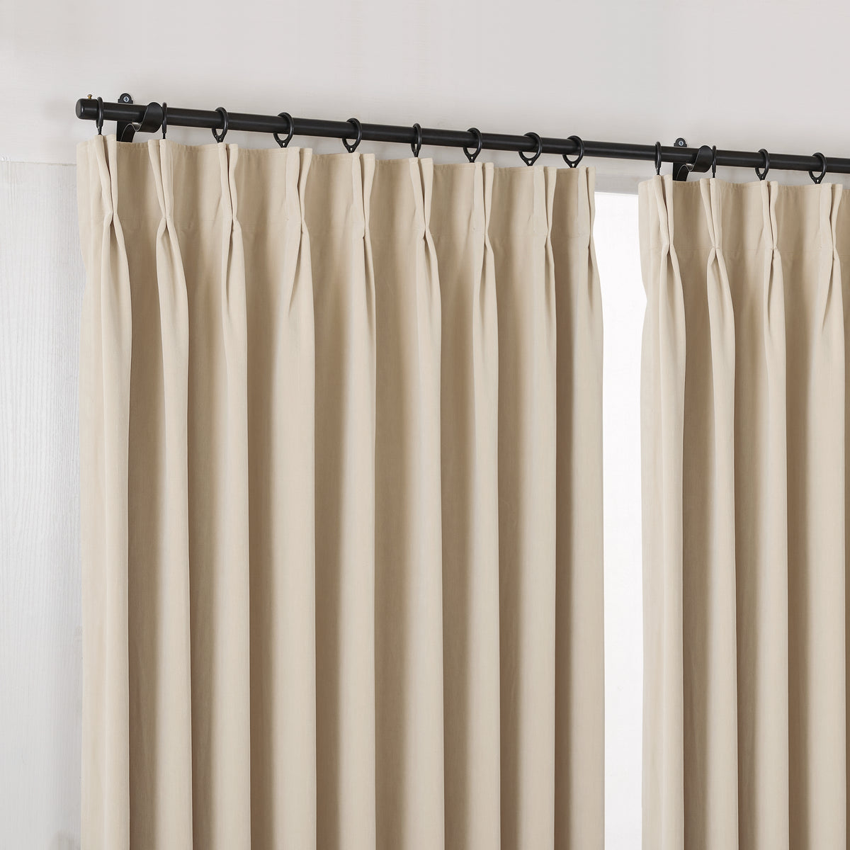 Sebastian Double-Faced Velvet Blackout Curtains in Flax, hanging at the window