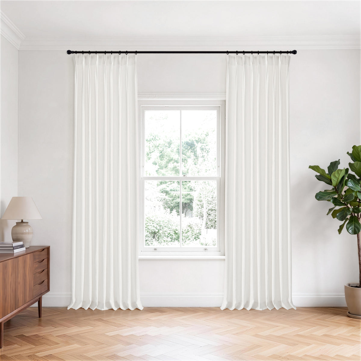 Odile Vine Sheer Curtains in White, hanging in a room