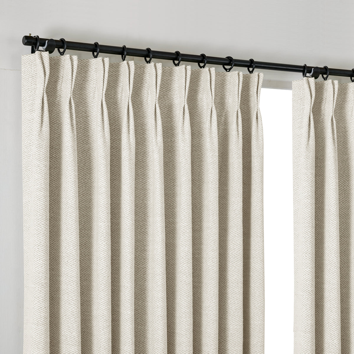 Pembroke Herringbone Weave Curtains in Oat, hanging at the window