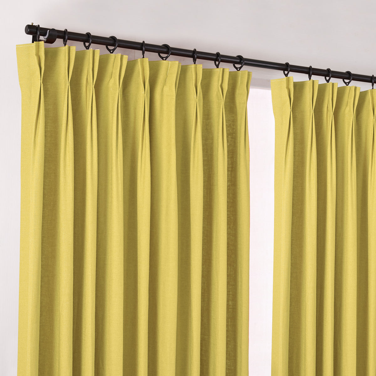Edwina Linen-Cotton Curtains in Chartreuse, hanging at the window