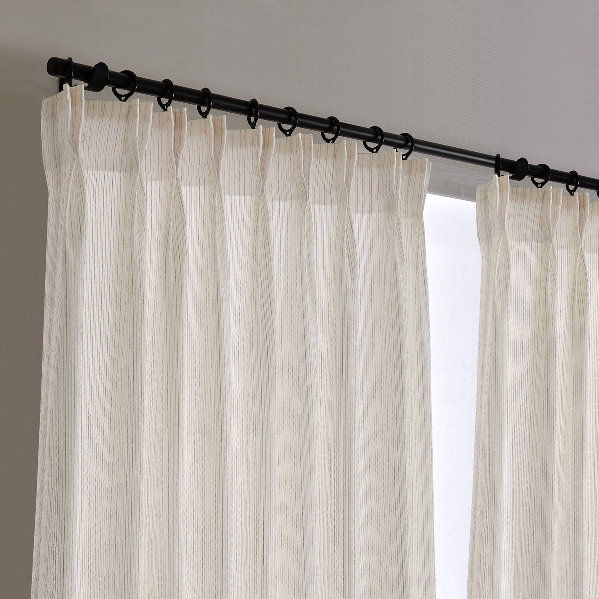 Esme Fine Voile Sheer Curtains in Greige, hanging at the window