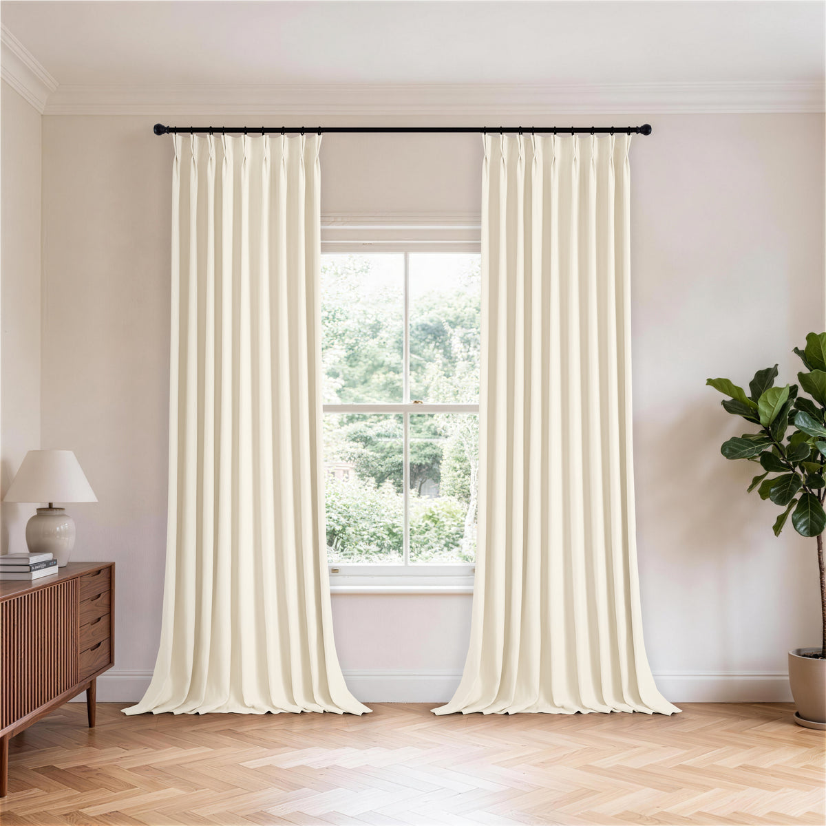 Cordelia Sculpted Chenille Blackout Curtains in Oat, hanging in a room