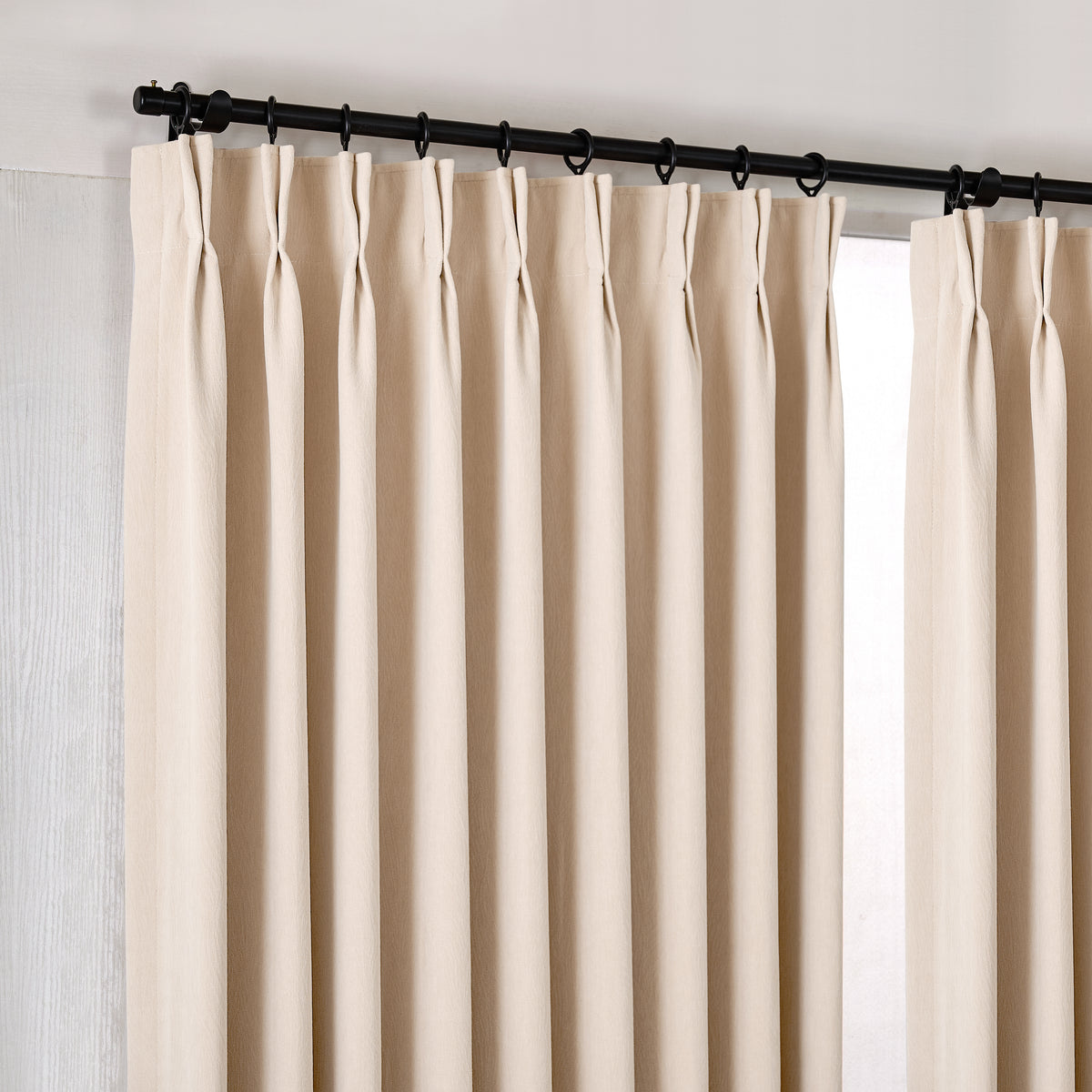 Ottilie Plush Chenille Blackout Curtains in Rich Ivory, hanging at the window