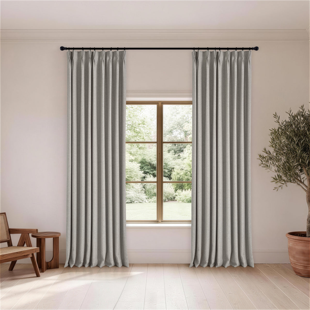 Ansel Slub Weave Curtains in Pewter, hanging in a room
