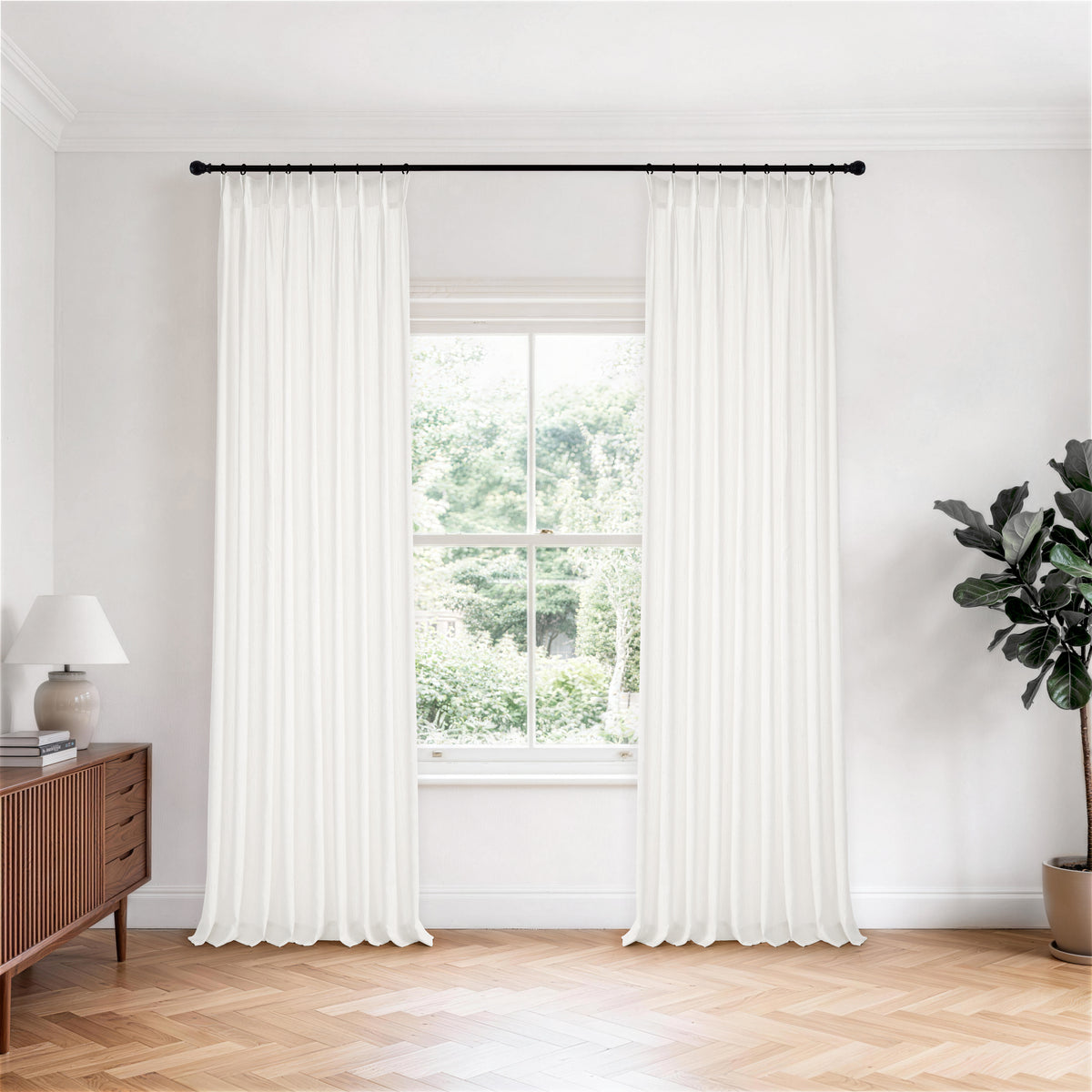 Odile Dandelion Sheer Curtains in White, hanging in a room