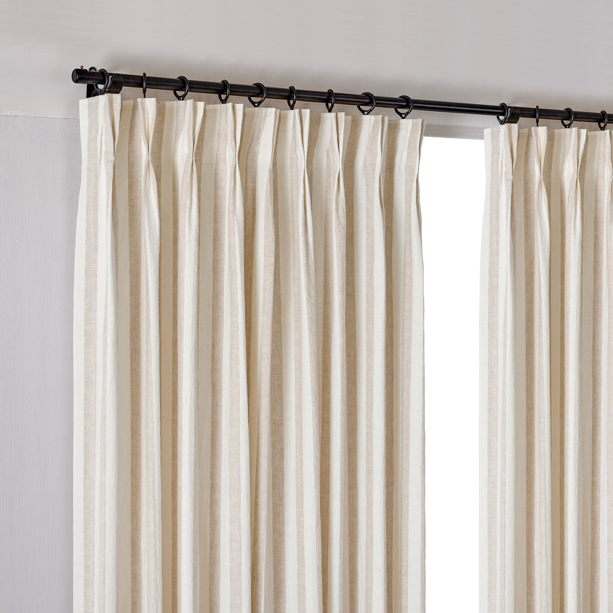 Carrick Striped Pure Linen Curtains in Flax Bold Check, hanging at the window