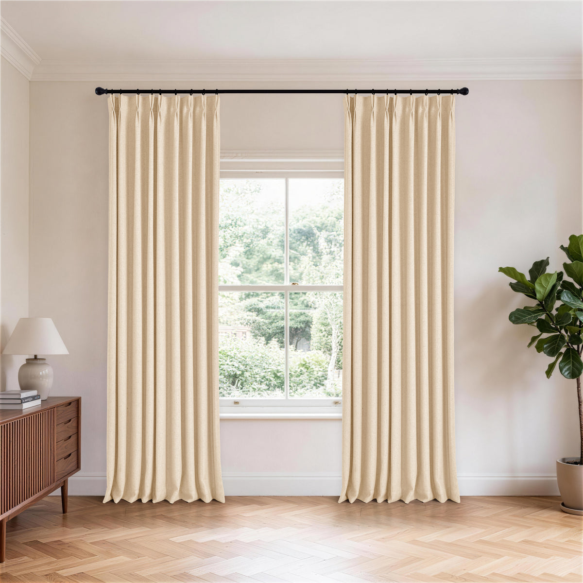 Ansel Slub Weave Curtains in Oat, hanging in a room
