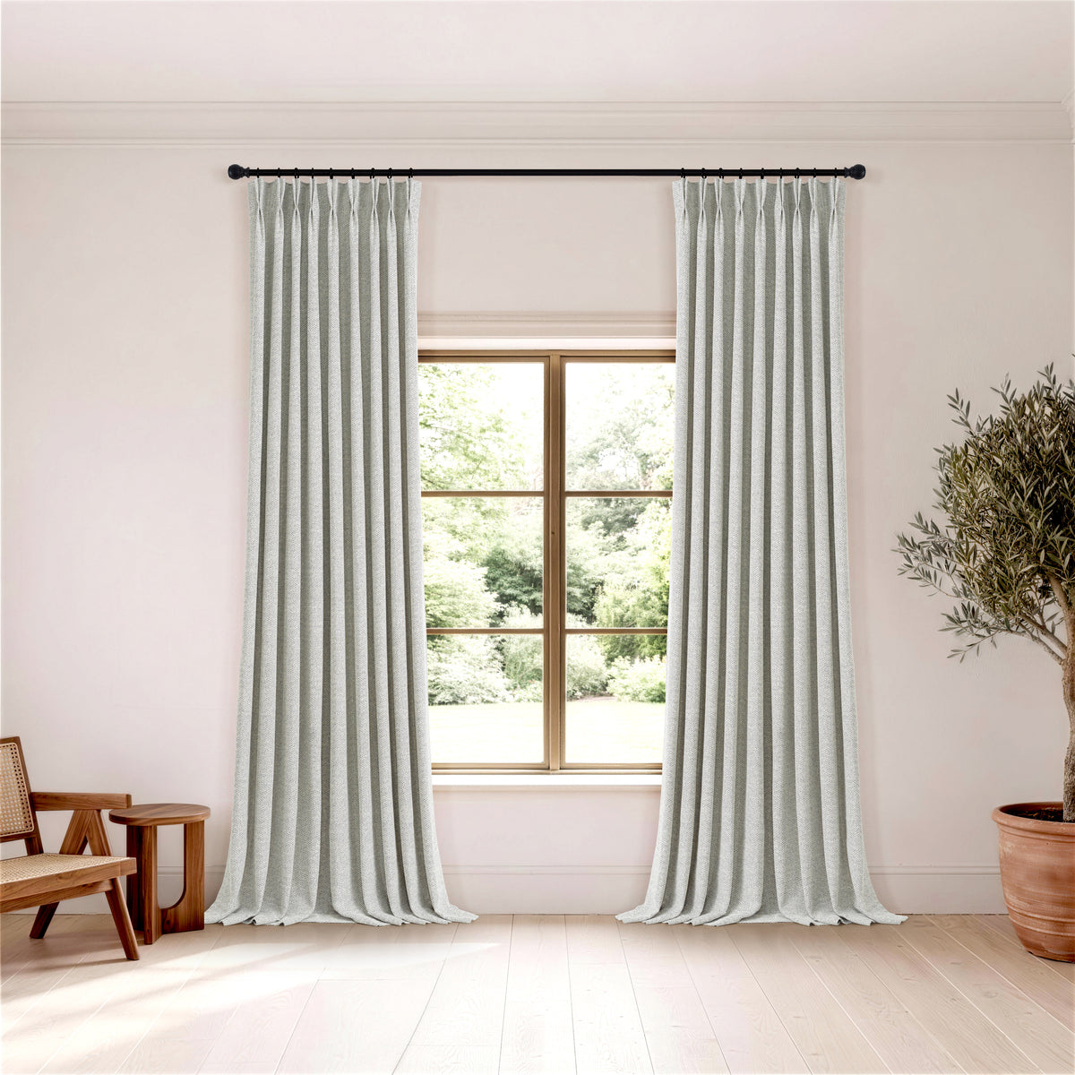 Pembroke Chevron Weave Curtains in Pewter, hanging in a room