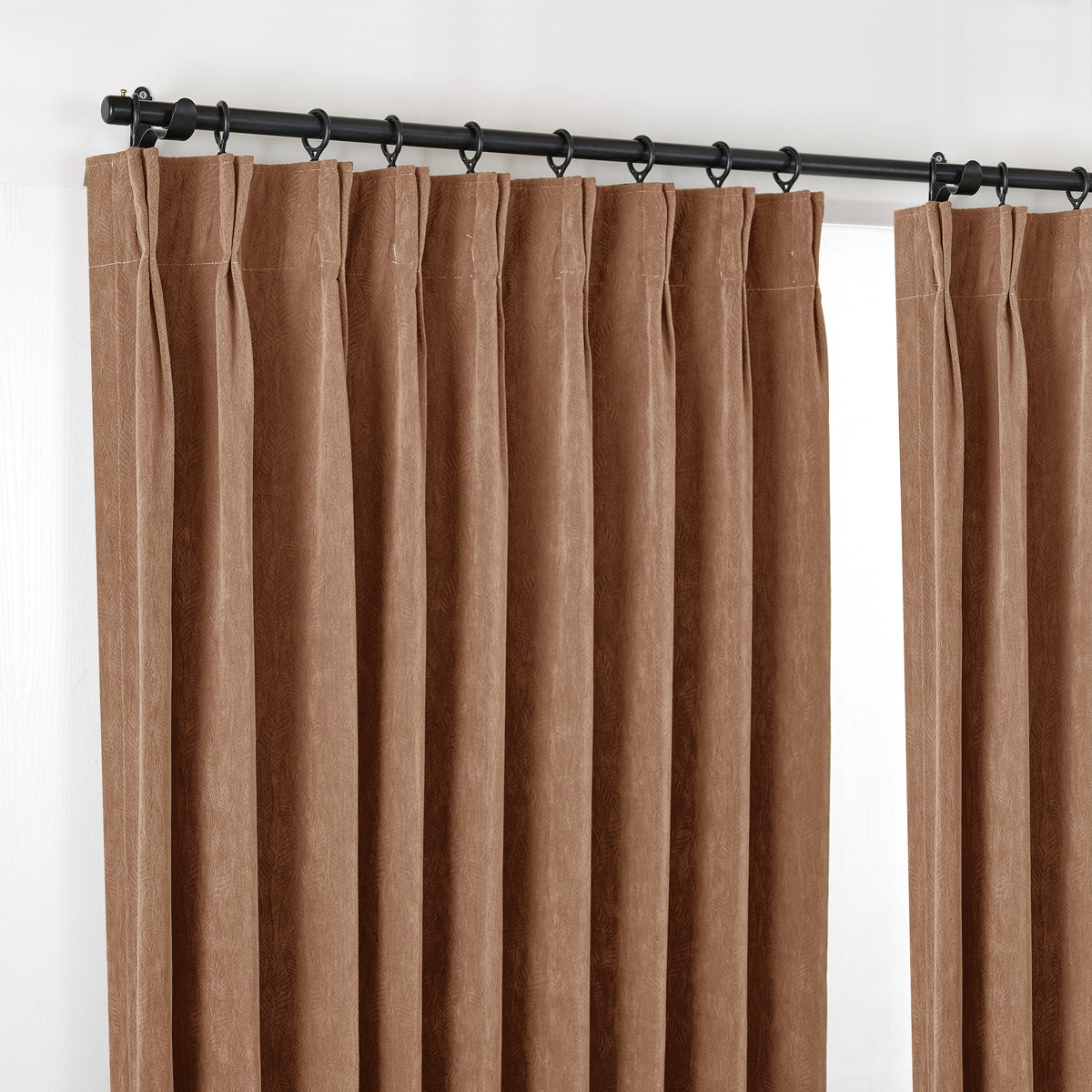 Cordelia Sculpted Chenille Blackout Curtains in Cocoa, hanging at the window