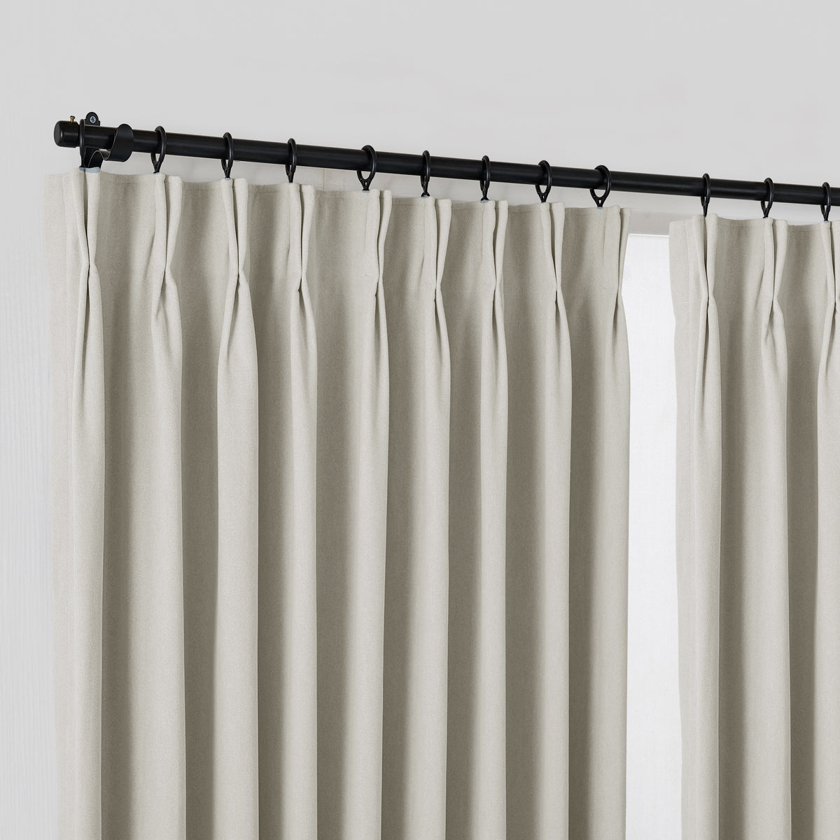 Ingram Brushed Weave Blackout Curtains in Greige, hanging at the window
