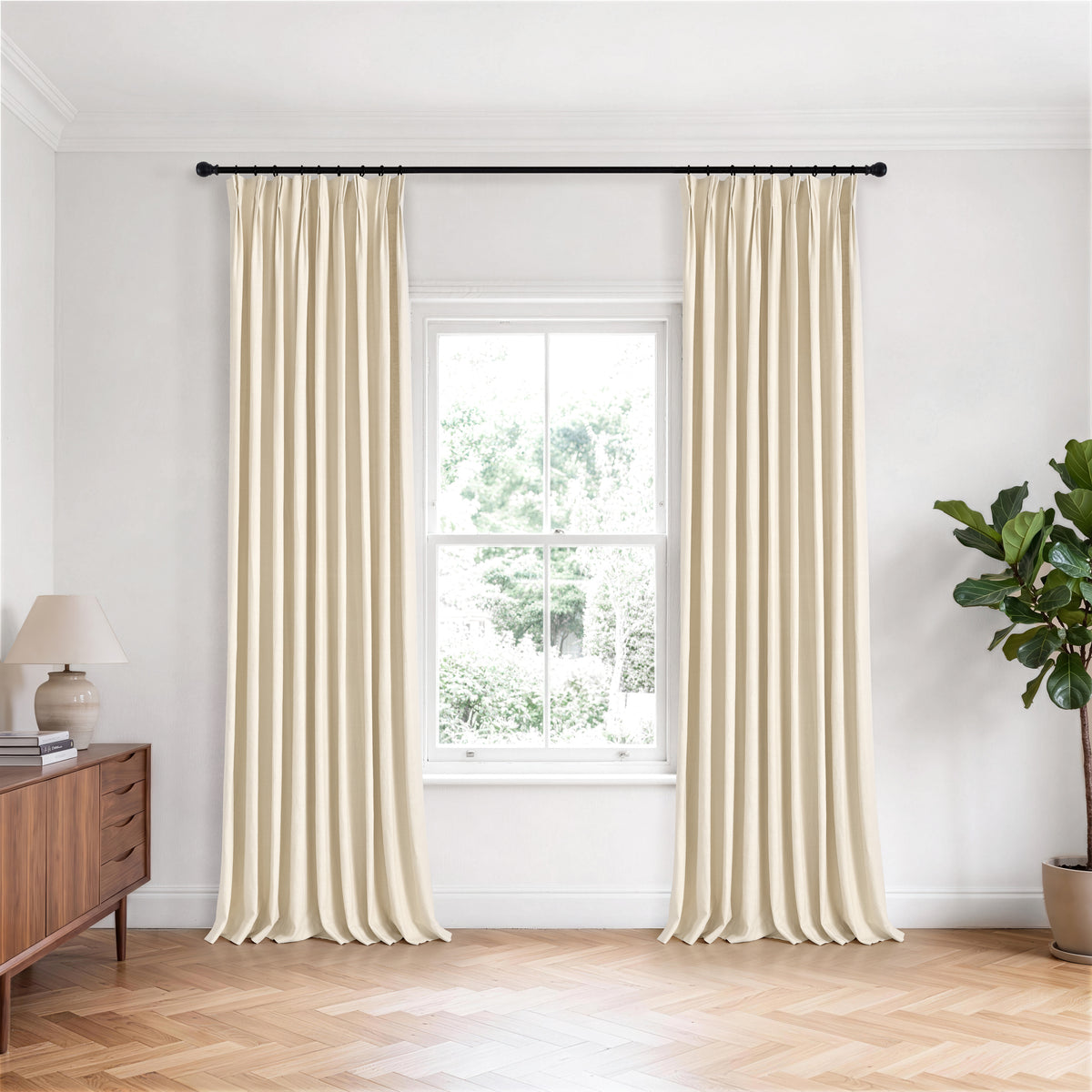 Edwina Linen-Cotton Curtains in Ivory, hanging in a room