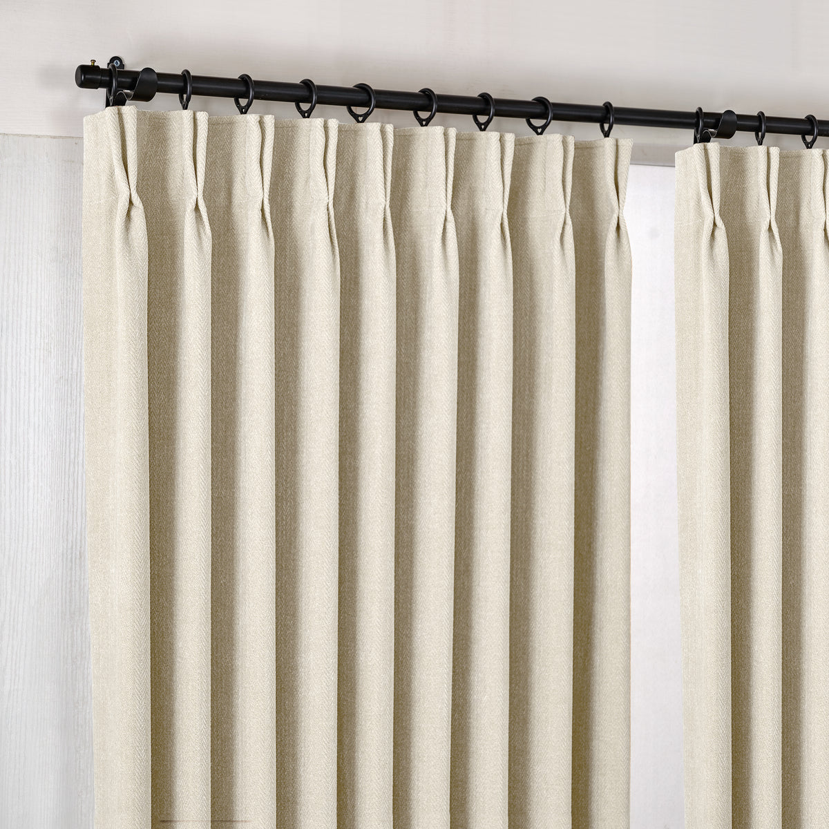 Hadleigh Herringbone Blackout Curtains in Ivory, hanging at the window