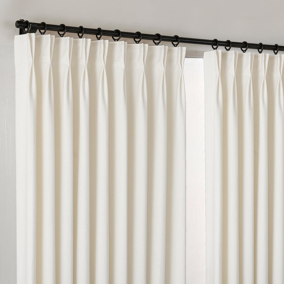 Forrester Linen-Blend Slub Curtains in Chalk, hanging at the window