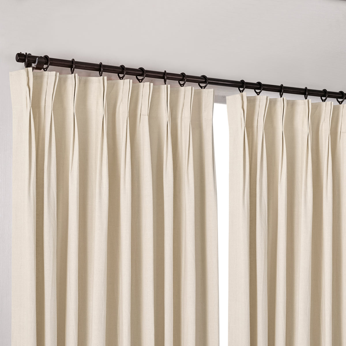 Edwina Linen-Cotton Curtains in Natural, hanging at the window