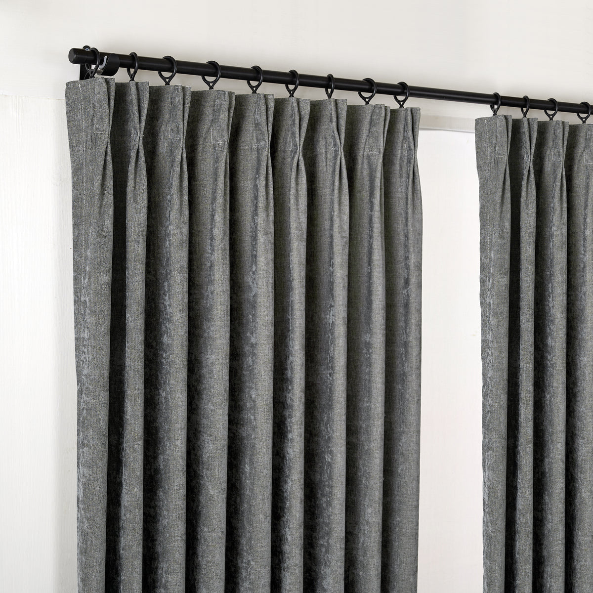 Prentiss Reversible Slub Curtains in Charcoal, hanging at the window