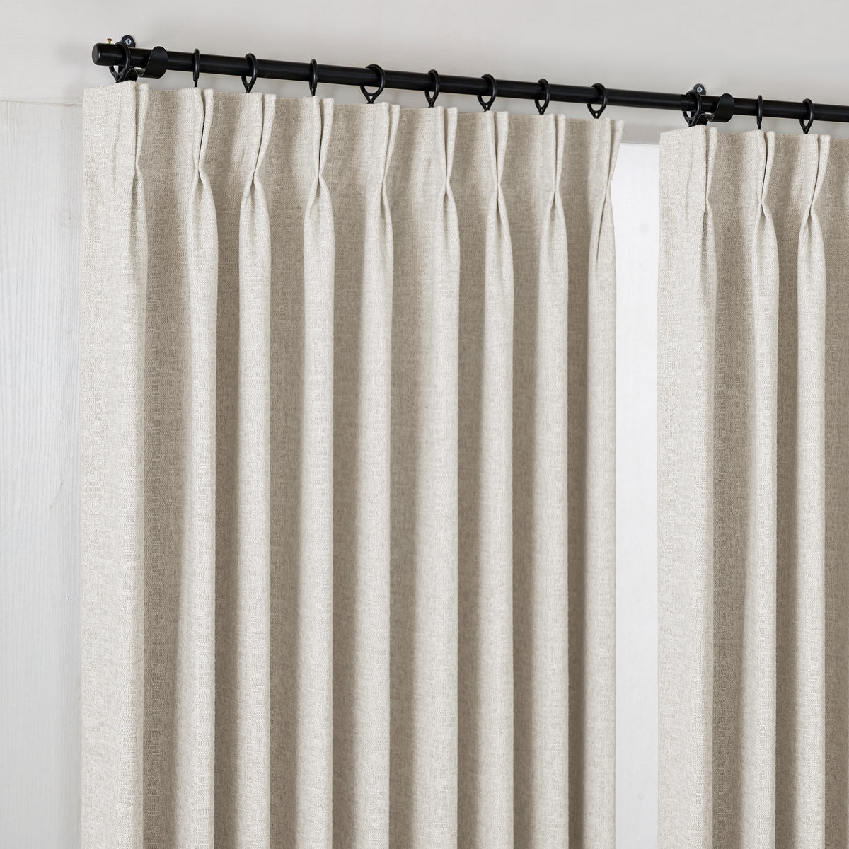 Everett Yarn-Dyed Jacquard Blackout Curtains in Chalk, hanging at the window