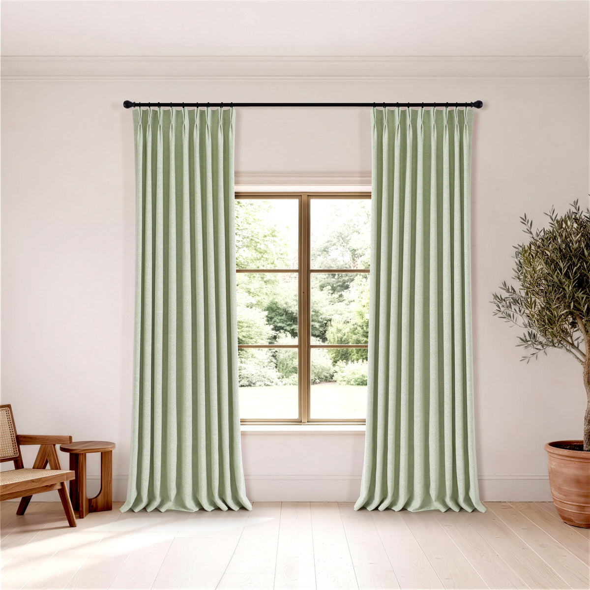 Pembroke Chevron Weave Curtains in Sage, hanging in a room