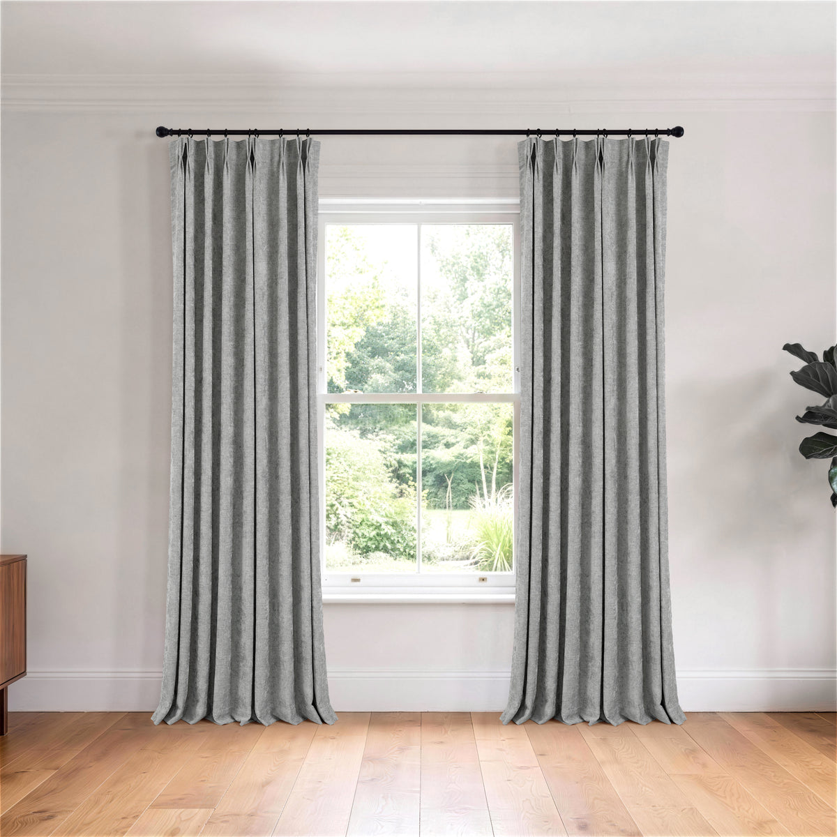 Prentiss Reversible Slub Curtains in Pewter, hanging in a room