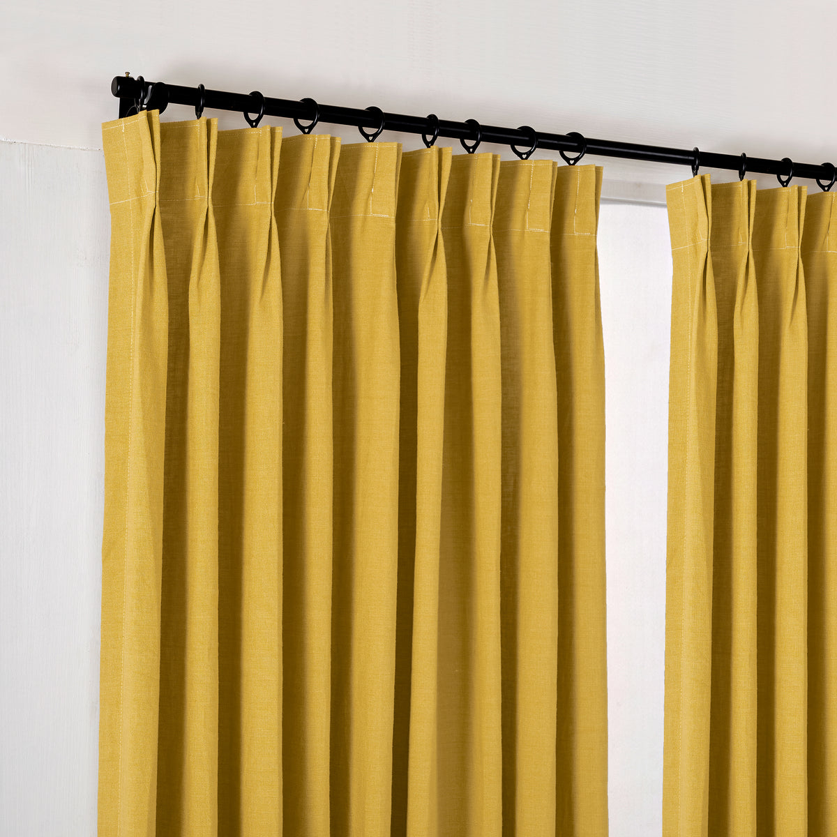 Ainsley Pure Linen Curtains in Ochre, hanging at the window