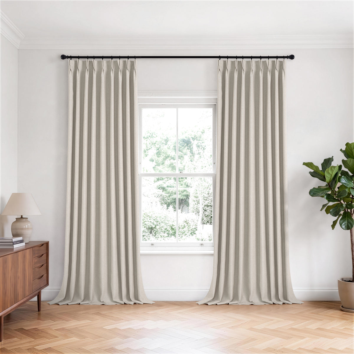Fraser Wool-Blend Blackout Curtains in Greige, hanging in a room