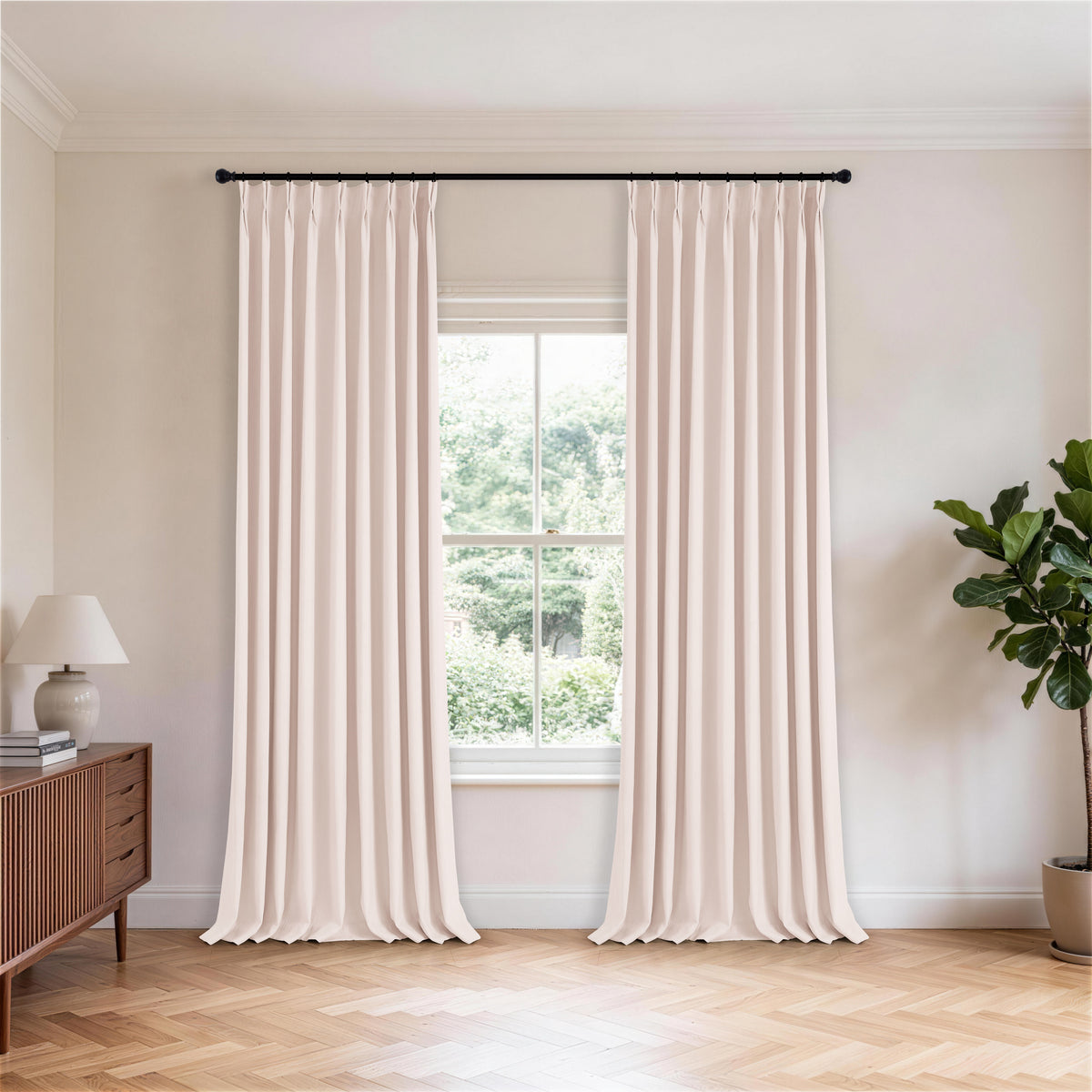 Cordelia Sculpted Chenille Blackout Curtains in Blush, hanging in a room