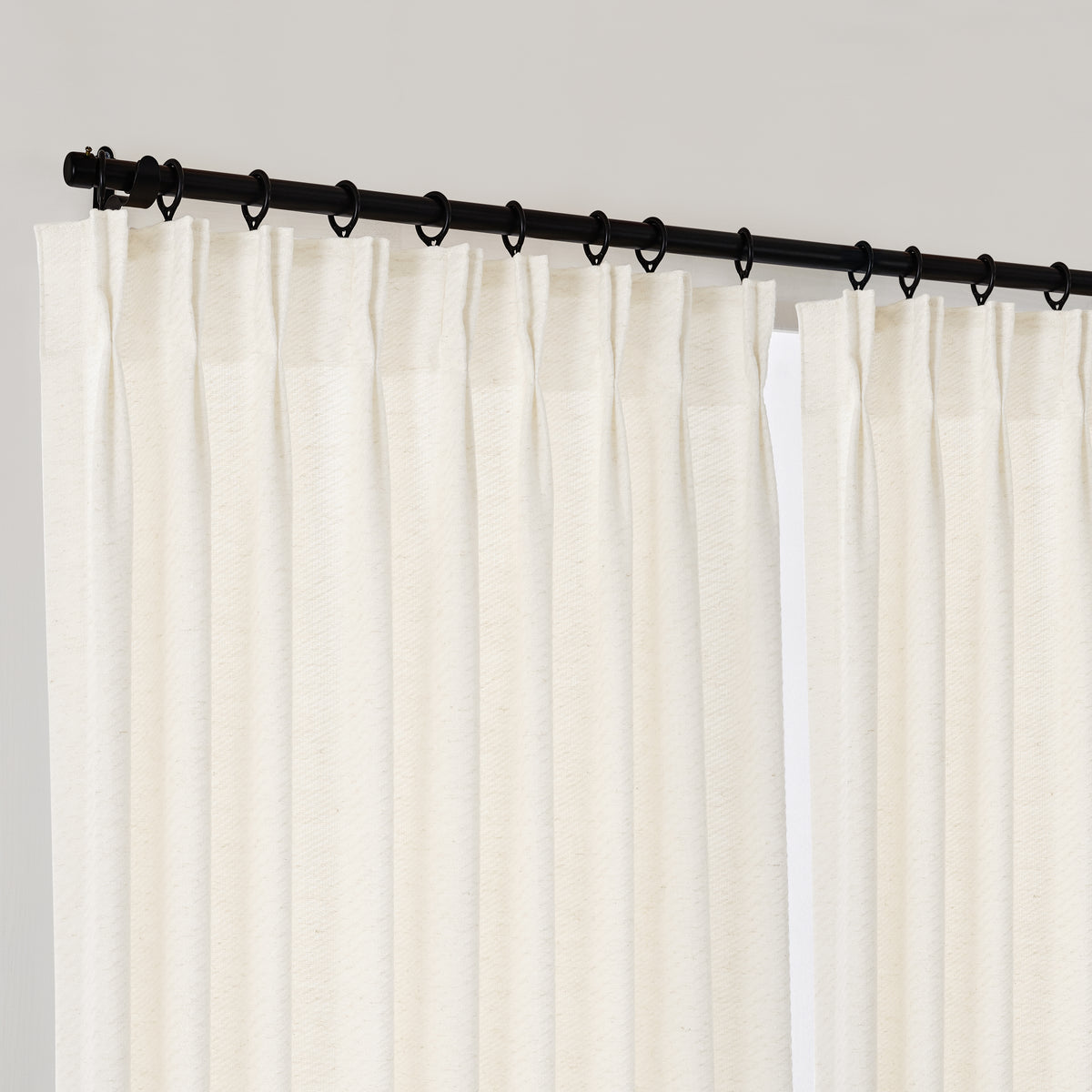 Lockwood Houndstooth Weave Curtains in Greige, hanging at the window