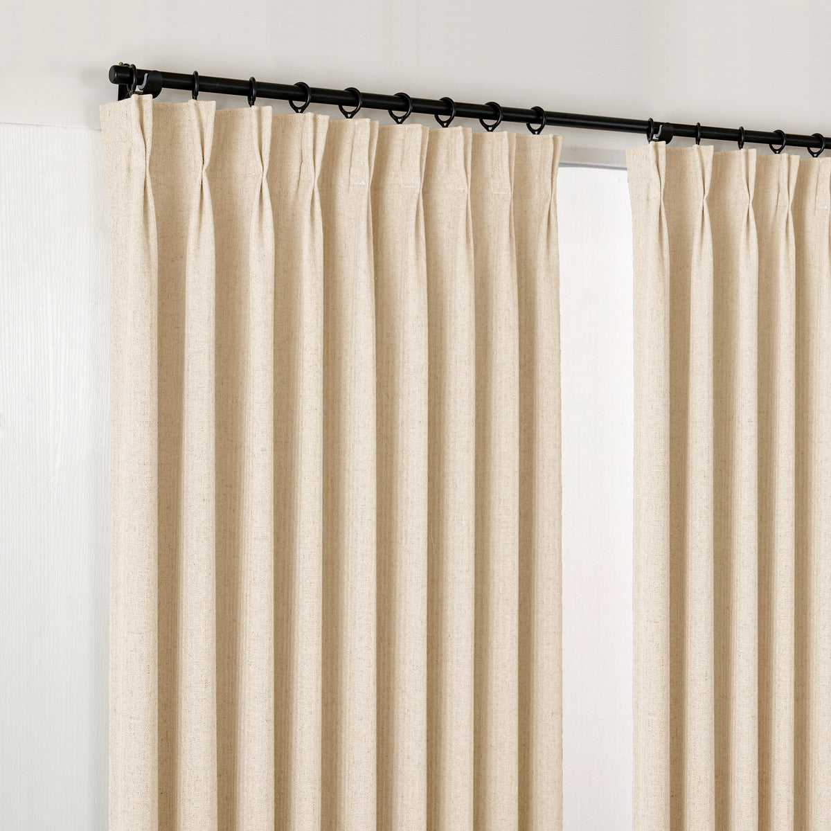 Ansel Slub Weave Curtains in Oat, hanging at the window