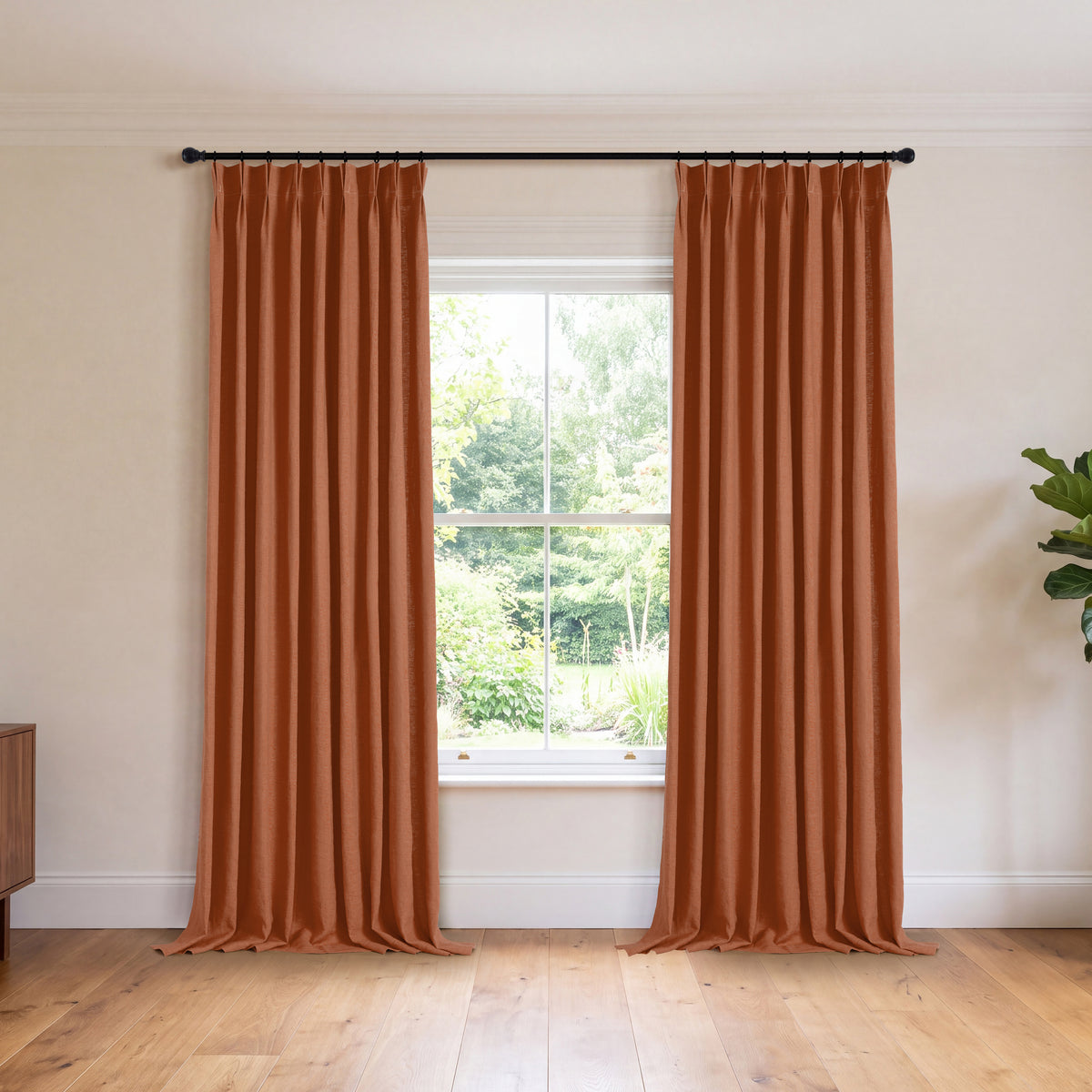 Ainsley Pure Linen Curtains in Rust, hanging in a room