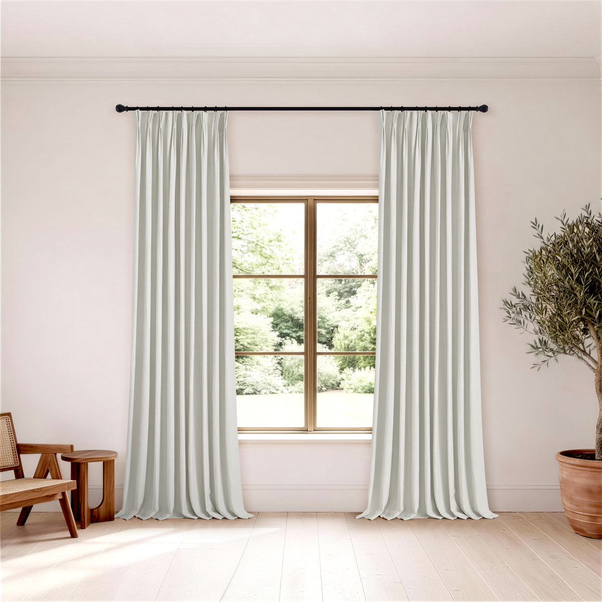 Edwina Linen-Cotton Curtains in Sage Gray, hanging in a room