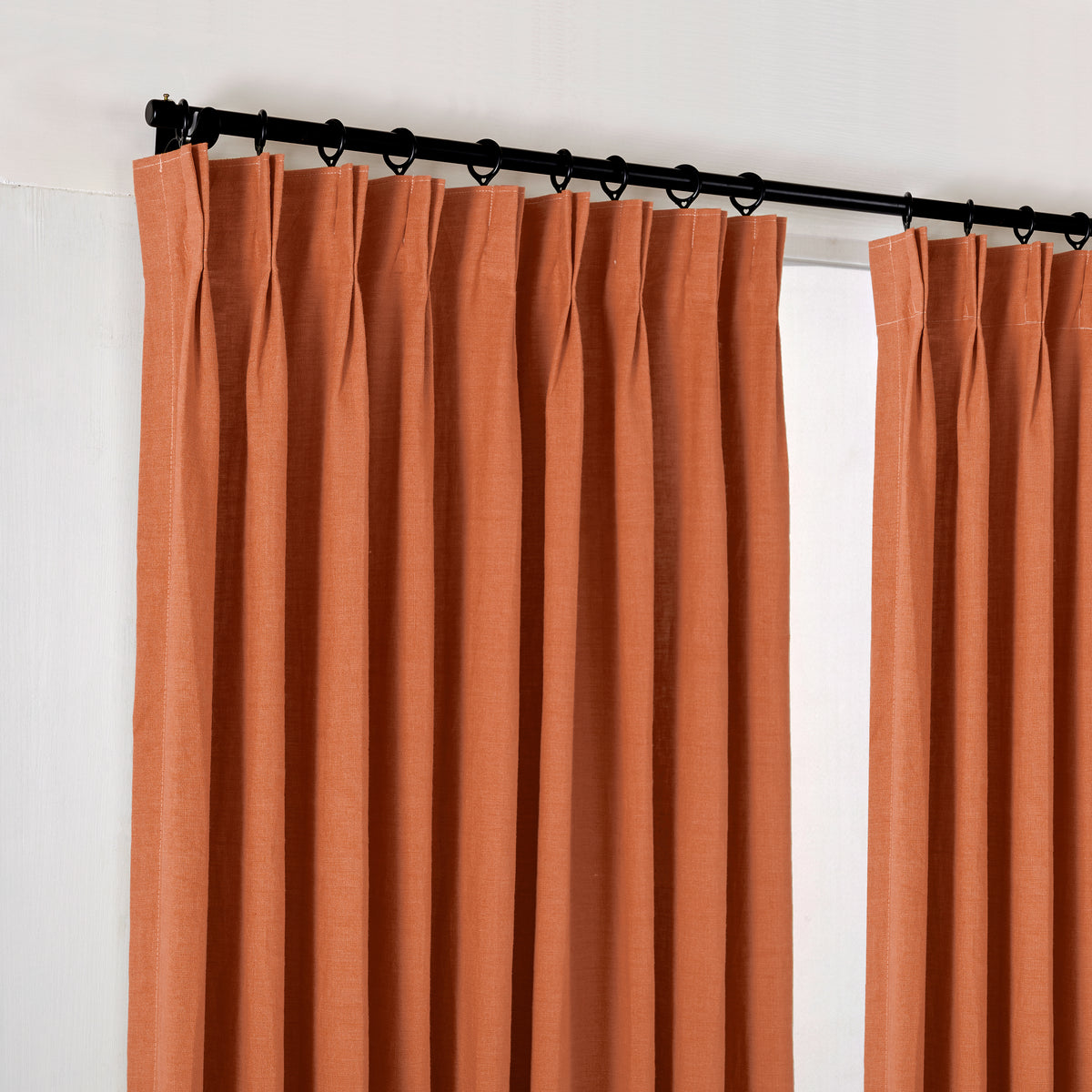 Ainsley Pure Linen Curtains in Rust, hanging at the window