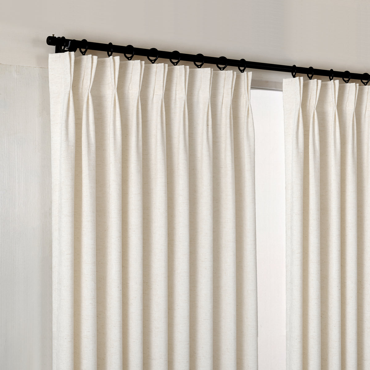 Prentiss Reversible Slub Curtains in Chalk, hanging at the window