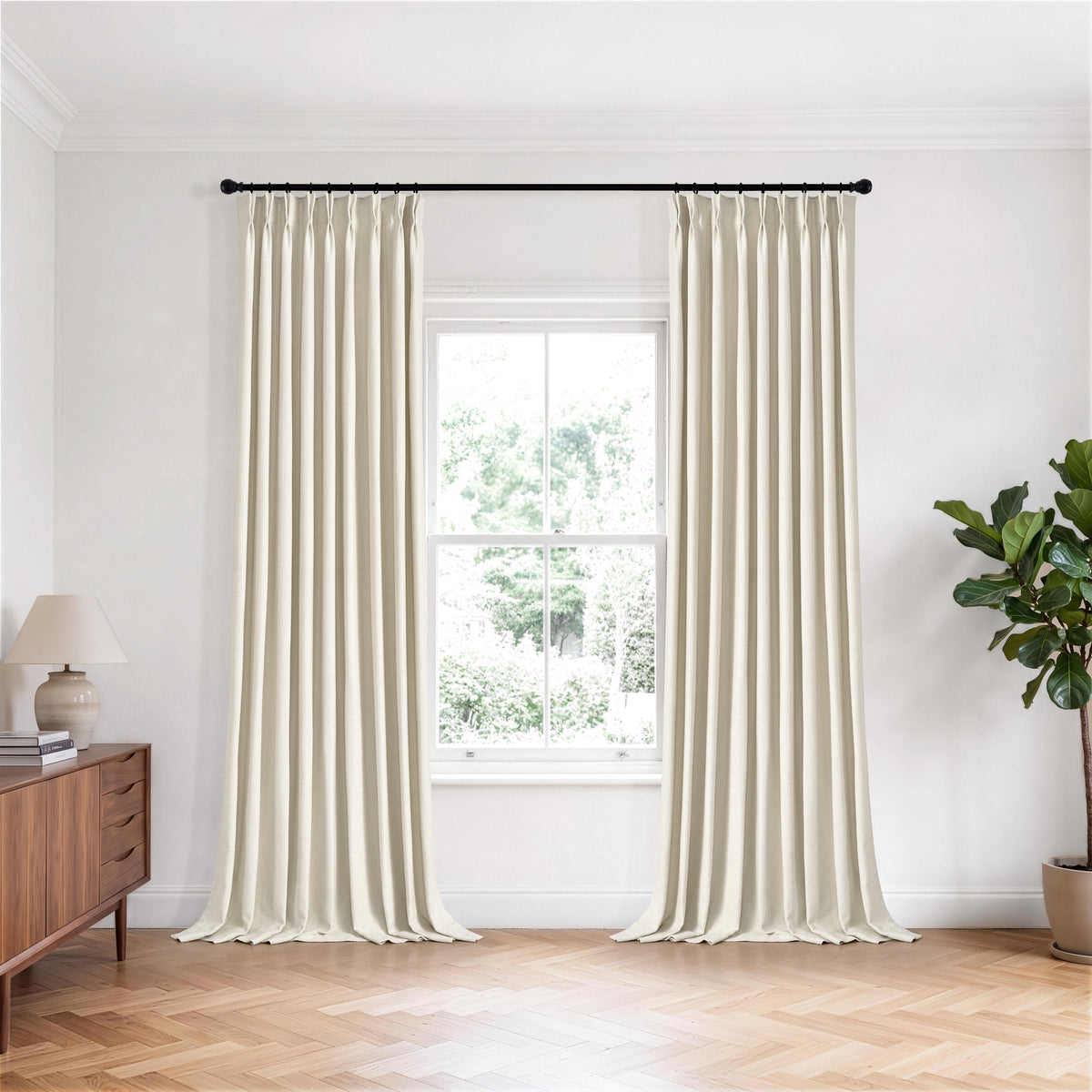 Pembroke Chevron Weave Curtains in Oat, hanging in a room