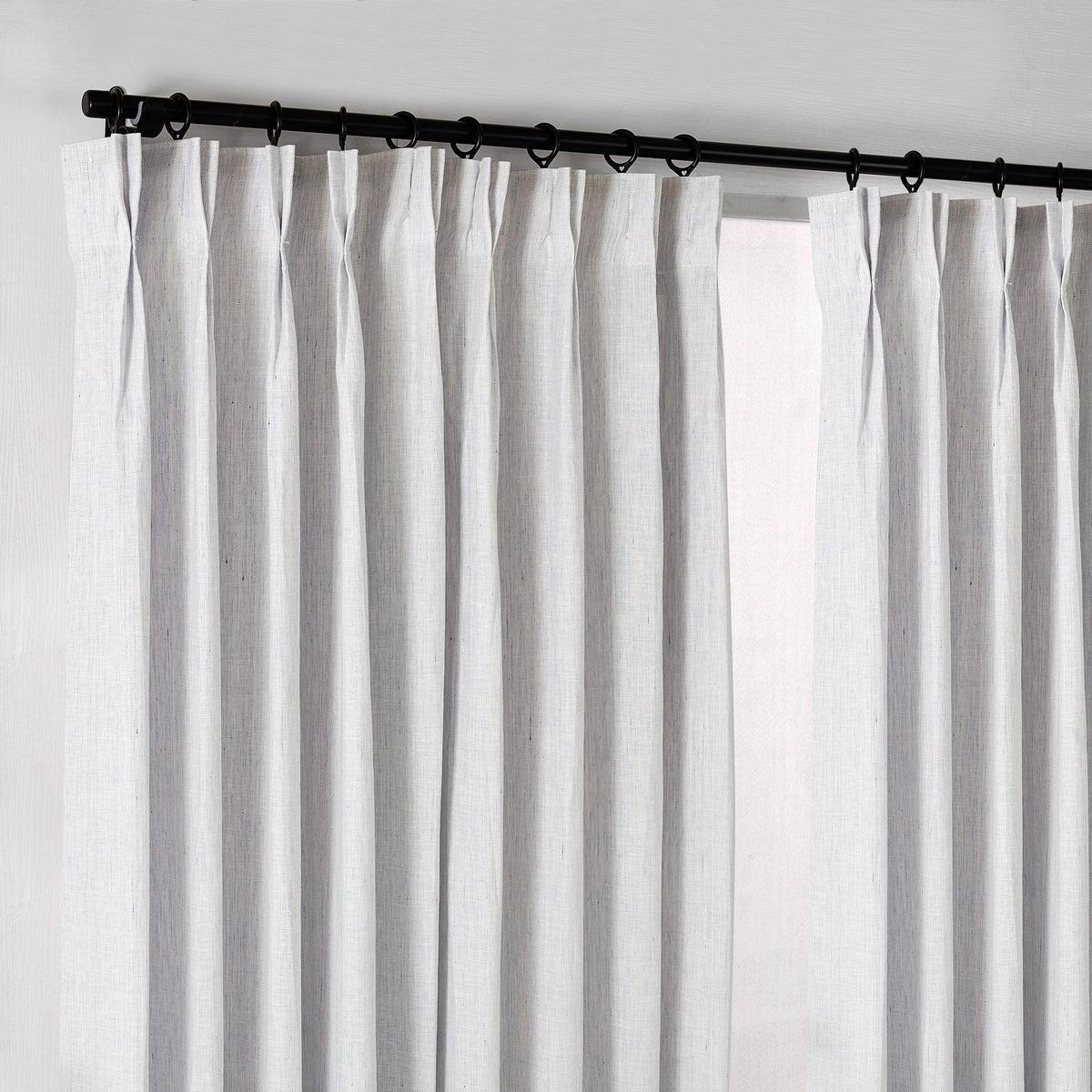 Rafe Slubbed Pure Linen Curtains in Powder Blue, hanging at the window