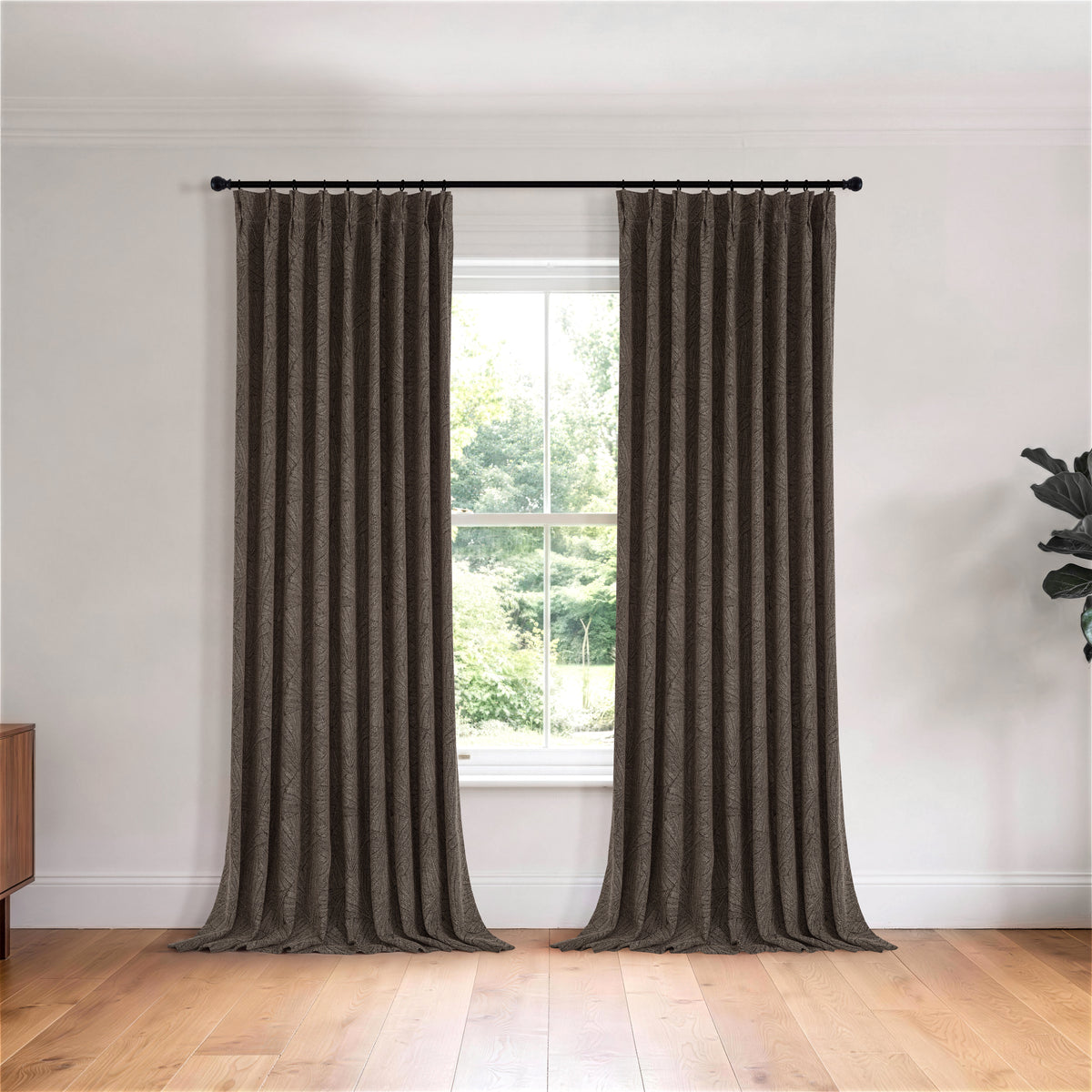 Bramwell Leaf Jacquard Blackout Curtains in Espresso, hanging in a room
