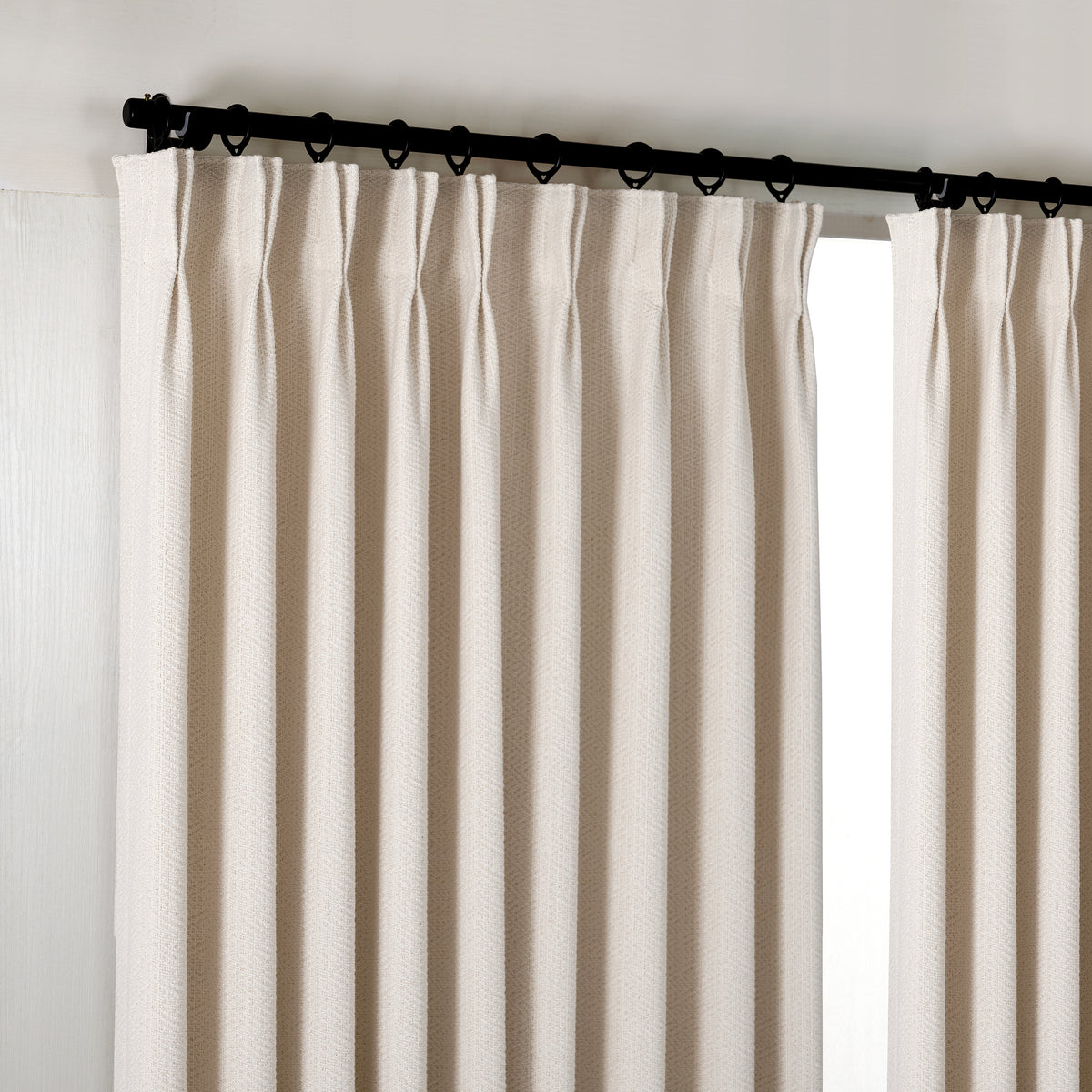 Pembroke Chevron Weave Curtains in Pale Greige, hanging at the window