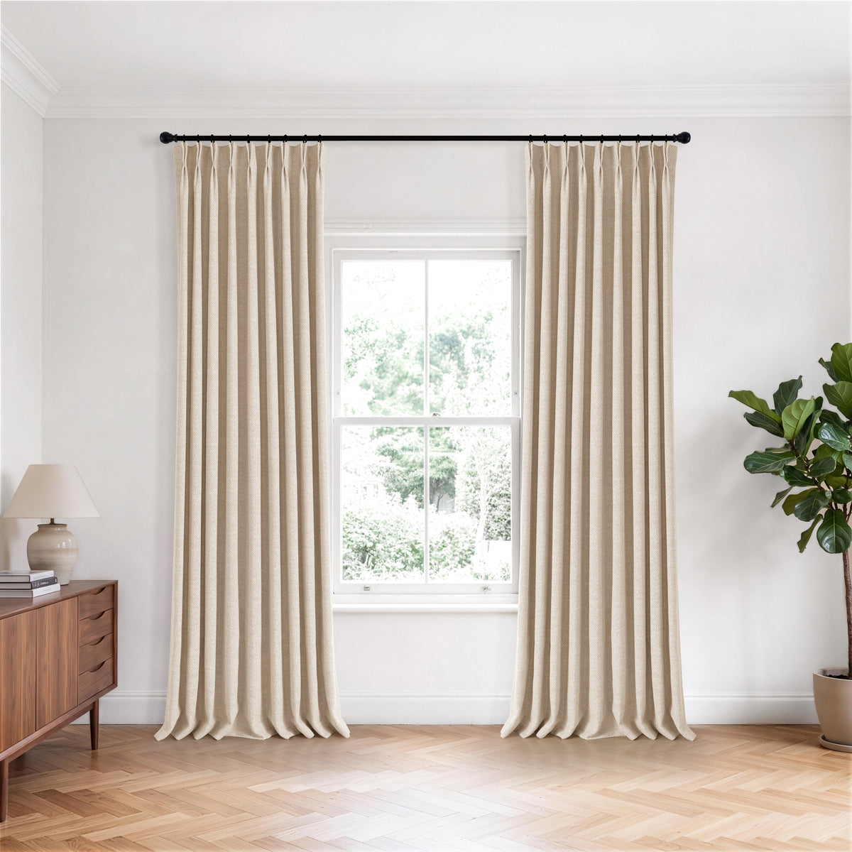 Pembroke Chevron Weave Curtains in Sand, hanging in a room