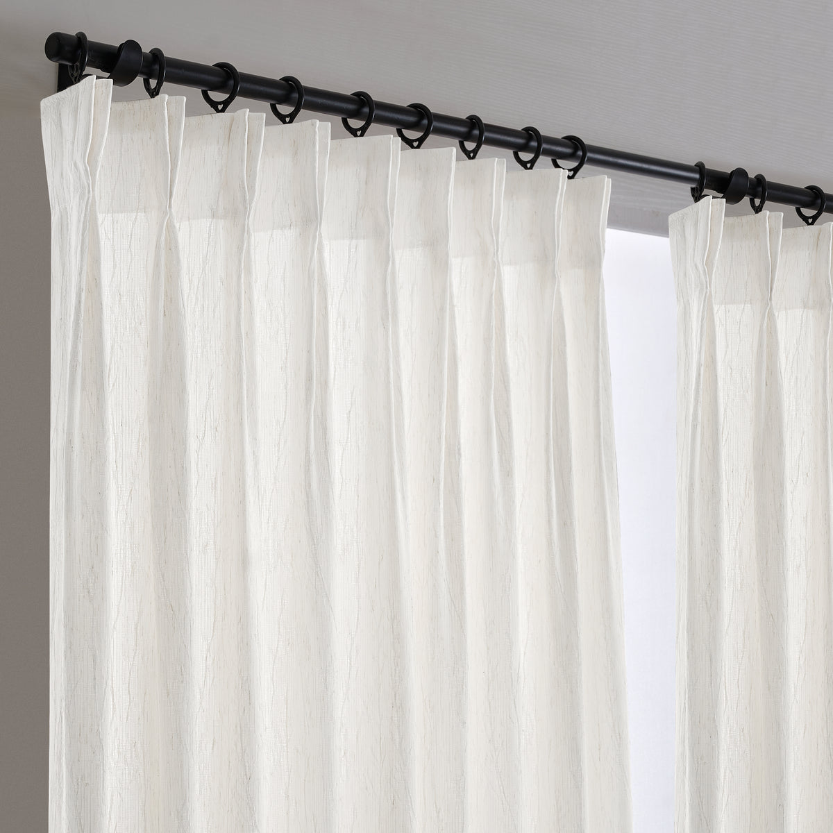 Odile Dandelion Sheer Curtains in White, hanging at the window
