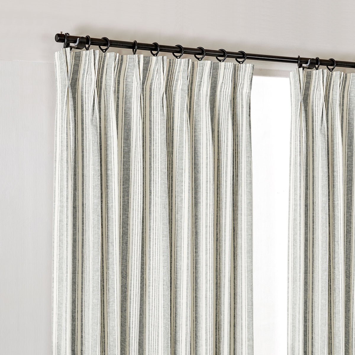 Carrick Striped Pure Linen Curtains in Juniper Ticking, hanging at the window