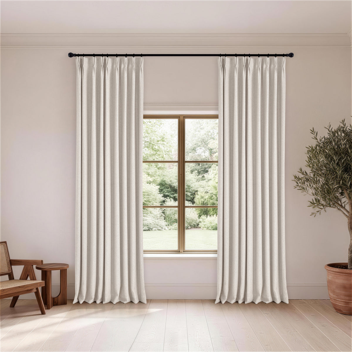 Ansel Slub Weave Curtains in Soft Greige, hanging in a room