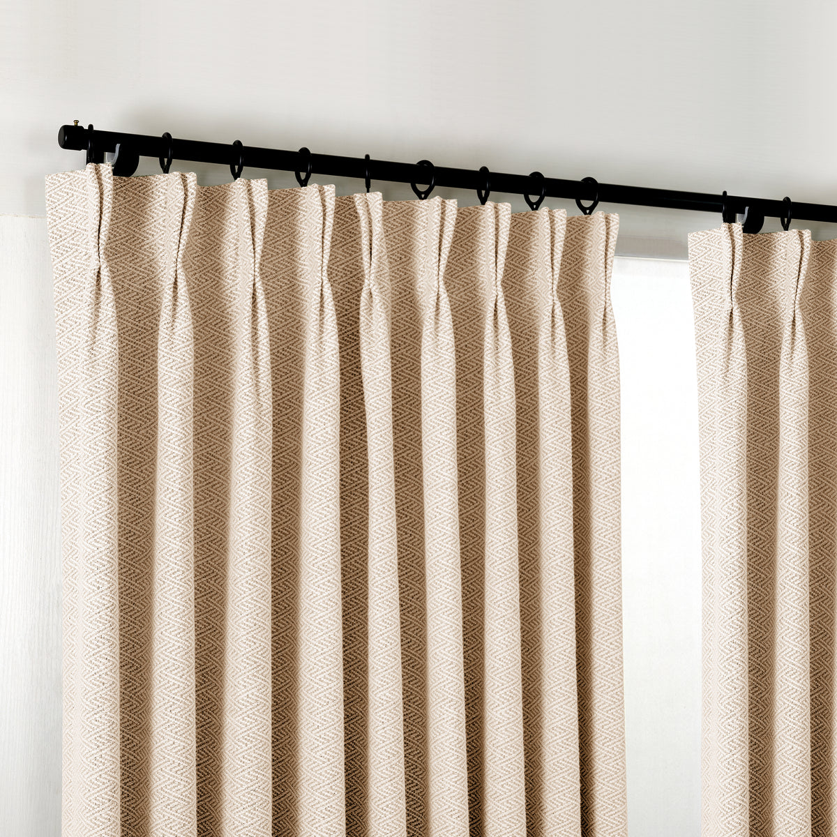 Pembroke Chevron Weave Curtains in Sand, hanging at the window